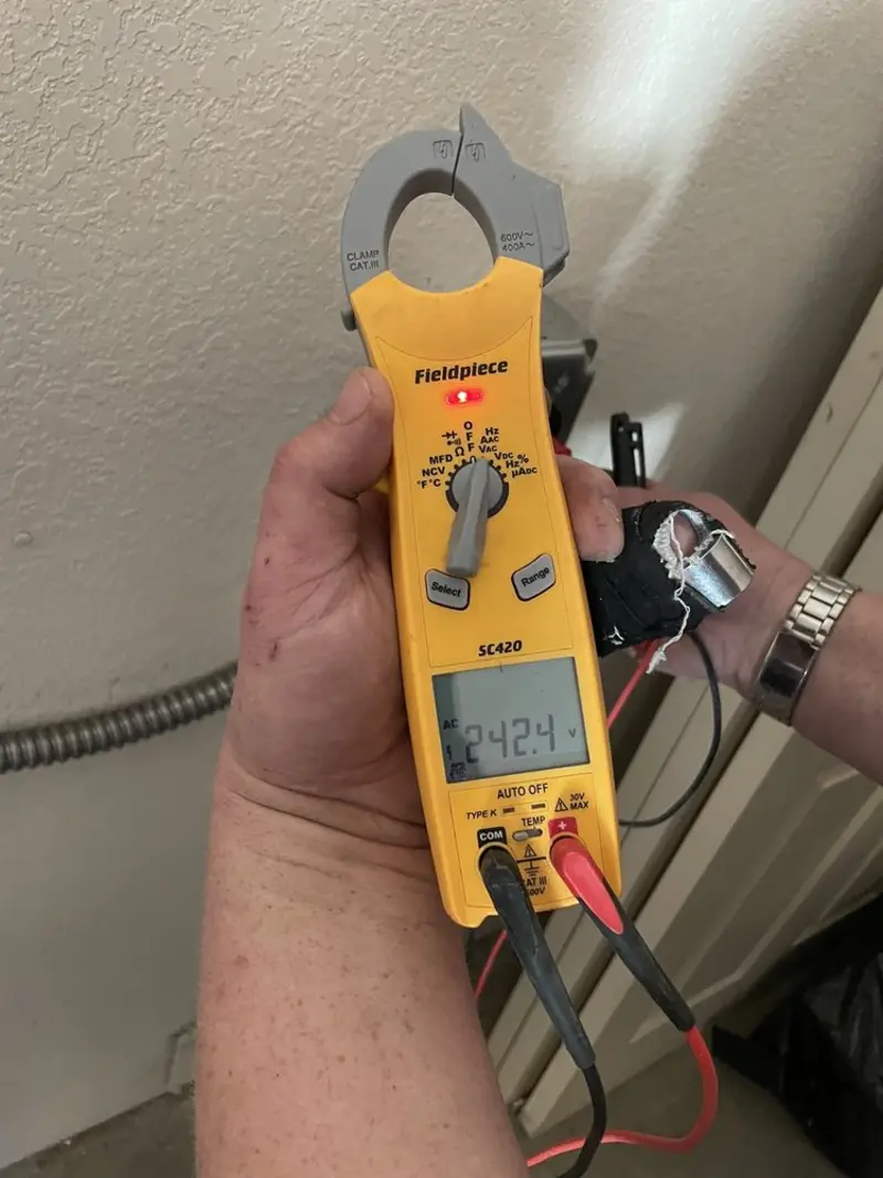 Voltage testing with clamp meter during Ceiling Fan Installation in Elgin